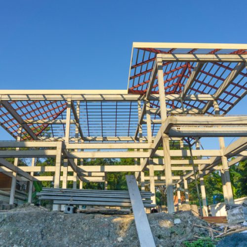 New residential construction home concrete framing against a blue sky